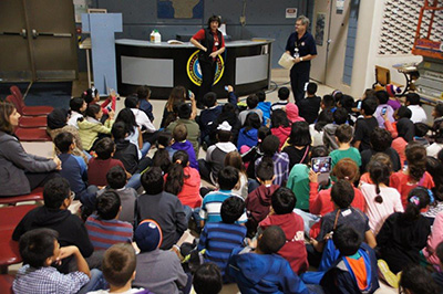 Grade 6 watching a presentation on an Aviation Field Trip at Warplane Museum