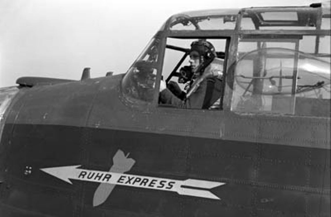 Pilot Officer Harold Floren sitting at the controls of KB700 Ruhr Express
